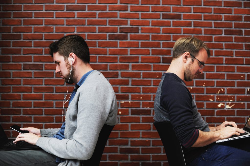 Two guys working on a fintech startup